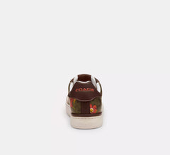 Coach Clip Low Top Sneaker In Signature Canvas With Floral Print / Dark Saddle - Women